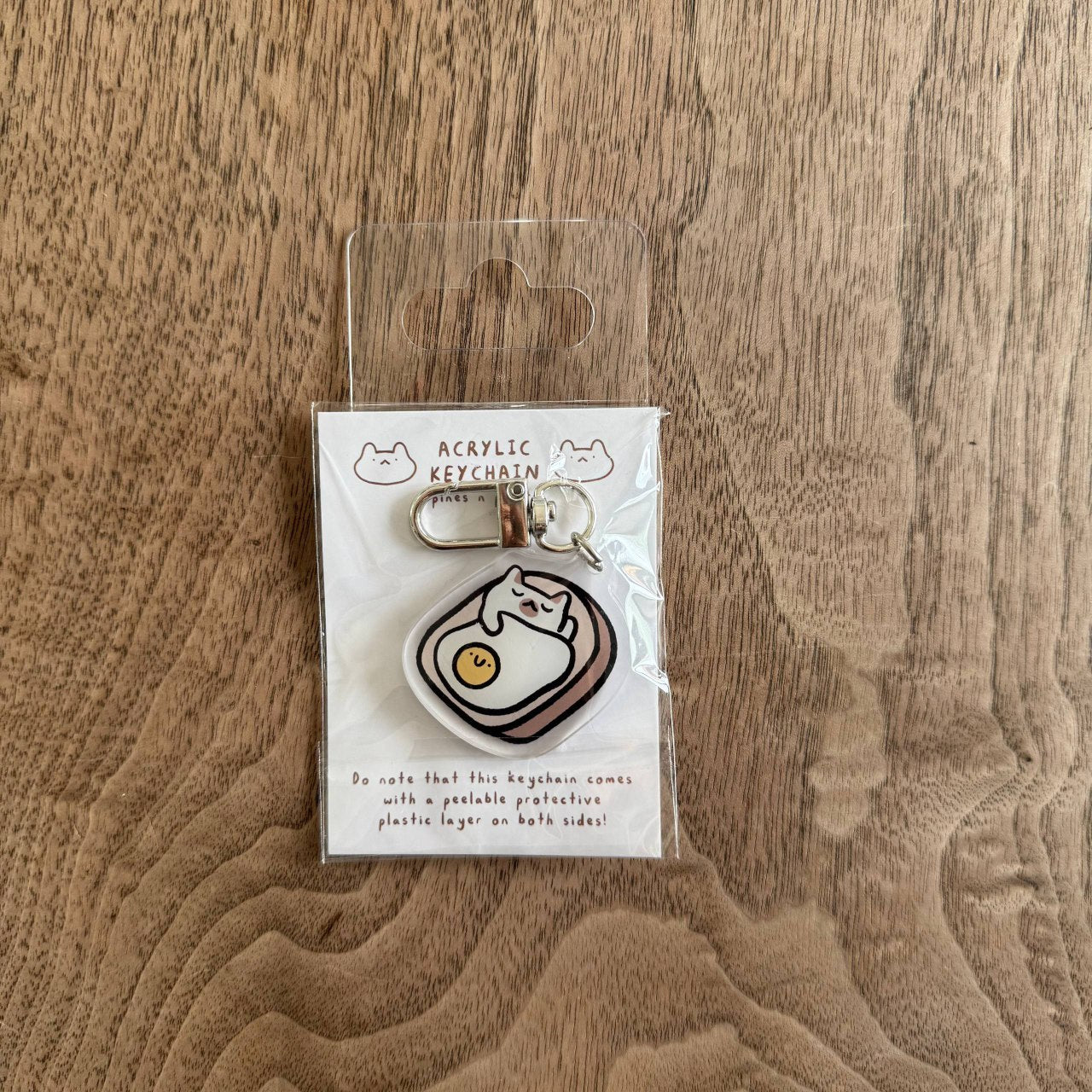 Cat egg bread nap acrylic keychain