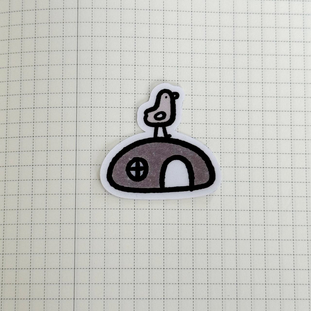 Bird on a rock (Tiny vinyl sticker)