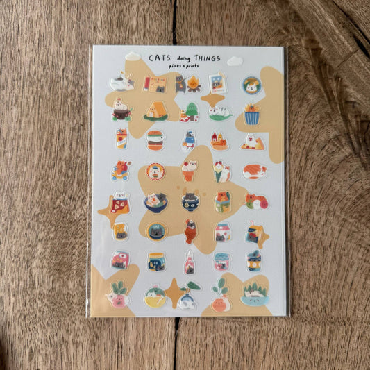 Cats doing things transparent sticker sheet
