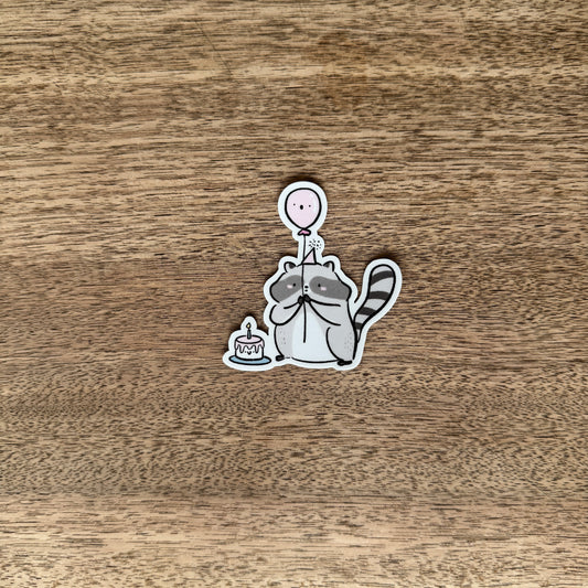 Racoon celebrating vinyl sticker